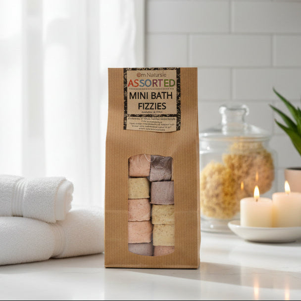 Om Naturale Assorted Mini Bath Fizzies 12‑pack with Rose, Lavender, and Surprise varieties, natural plant-based bath fizzies with botanicals and essential oils for calming and fragrant baths