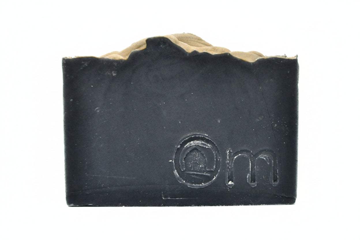 Om Naturale Hygge Farmcrafted Soap on white background, Canadian made natural soap with activated charcoal, vanilla, lavender and chamomile