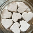 Eco-friendly fizzing toilet tab with peppermint and tea tree oil in bowl, handmade by Om Naturale, Armstrong, BC