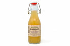 Nourishing Shampoo with Botanical Infusions by Om Naturale – soap-free plant-based cleanser in refillable glass bottle, infused with Omgrown herbal tea, plant keratin, Vitamin B, silk and oat protein, and lavender, rosemary, cedarwood, peppermint essential oils, farmcrafted in BC Canada.