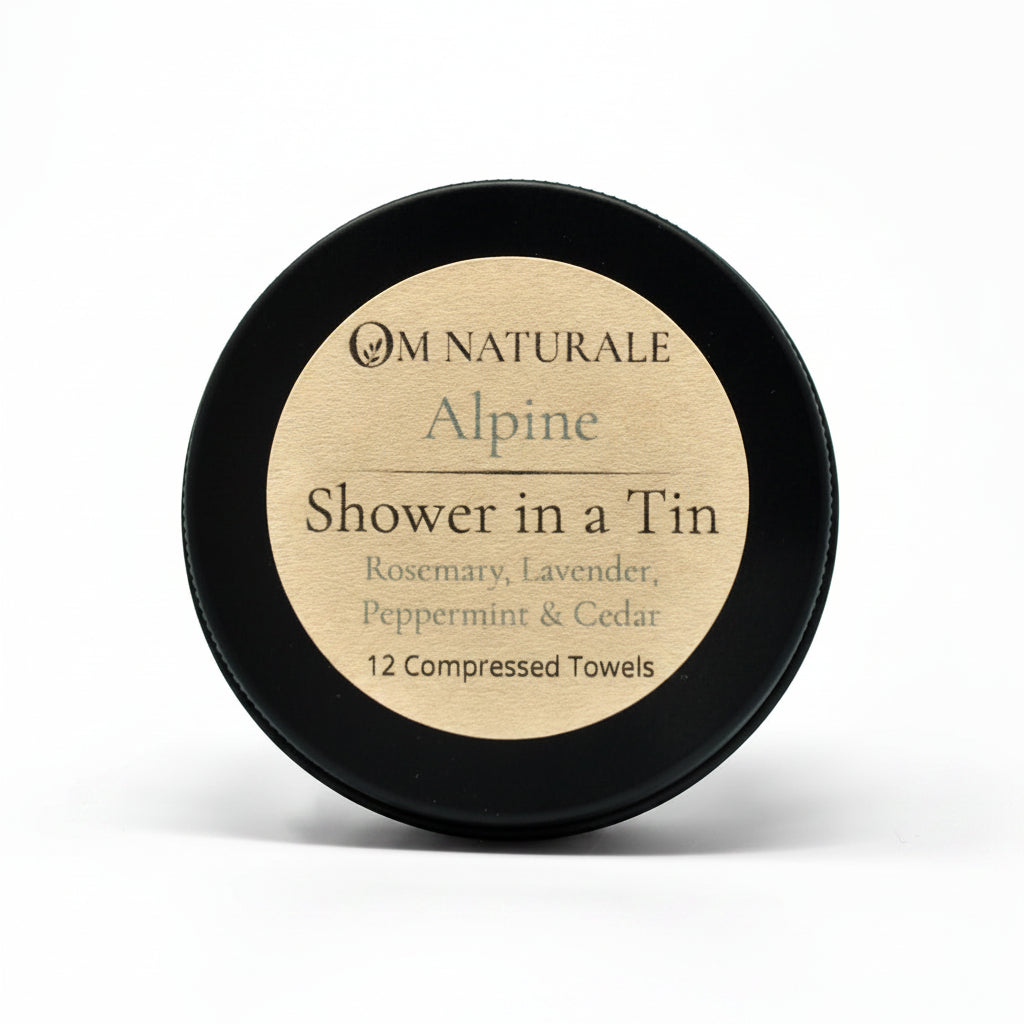 Om Naturale Alpine Shower in a Tin with compressed travel towels.