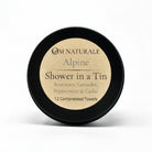 Om Naturale Alpine Shower in a Tin with compressed travel towels.
