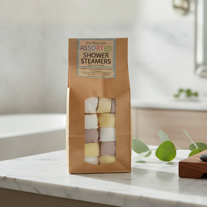 Om Naturale Assorted Shower Steamers 12-pack displayed in bathroom, plant-based aromatherapy tablets with eucalyptus, citrus, and lavender essential oils for refreshing and calming showers