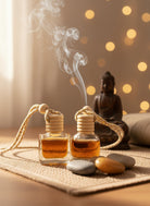 Buddha Car Diffuser by Om Naturale shown installed in a vehicle, natural essential oil fragrance with spearmint, patchouli, lavender and orange