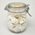 Om Naturale Buddha retail refill jar containing 120 compressed towels.
