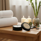 Open tin of Om Naturale Buddha Shower in a Tin showing compressed travel towels.