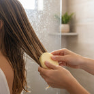 Applying Om Naturale Conditioner Bar, highlighting argan oil, shea butter and oat protein blend with lavender and spearmint essential oils for conditioning