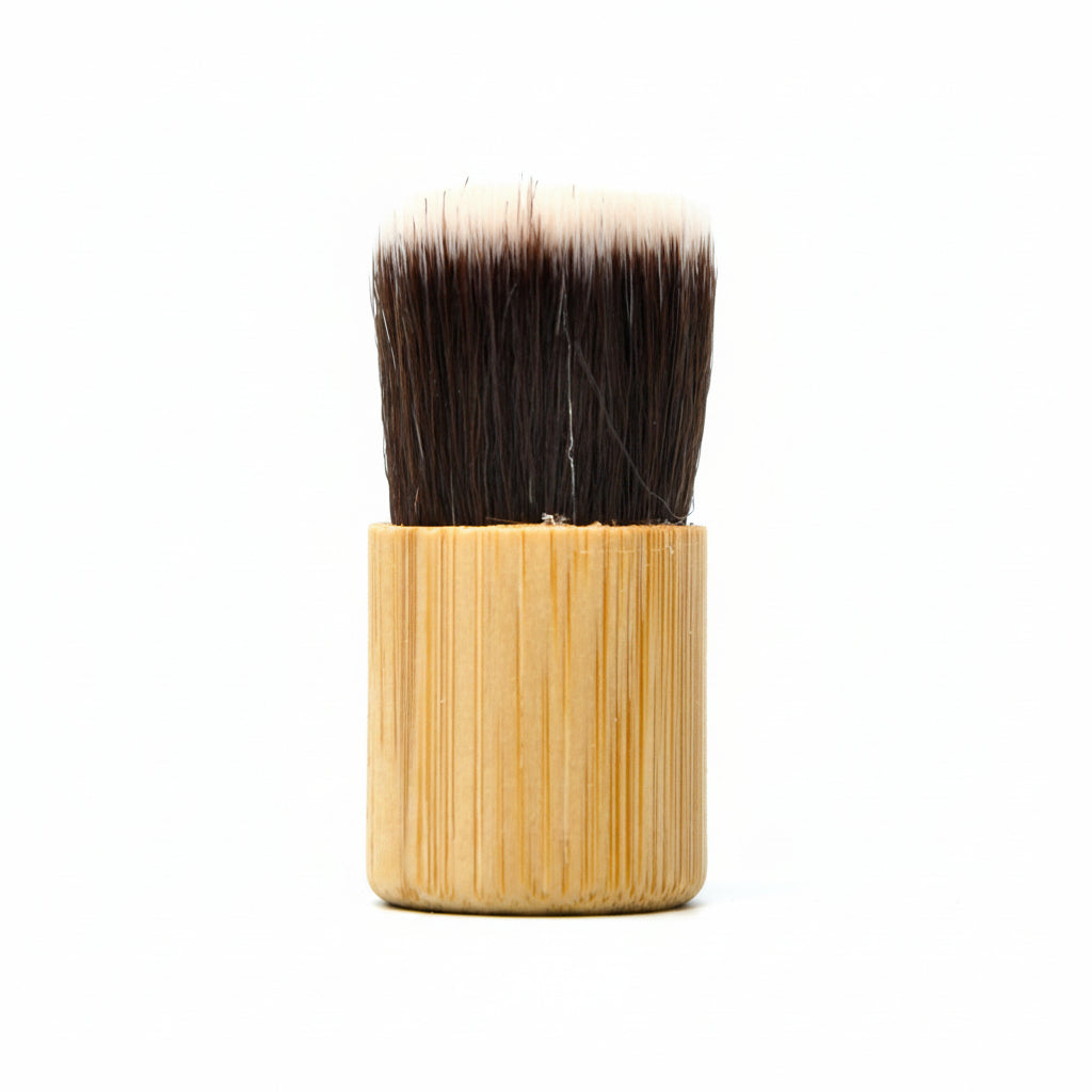 Soft bristle applicator brush used to add Om Naturale Natural Dry Shampoo to hair and scalp for daily hair maintenance.