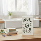 Om Naturale Eco Cleaning Sponge featuring exclusive botanical artwork printed on a reusable compostable cellulose sponge.