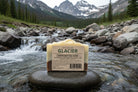 Om Naturale Glacier Farmcrafted Soap along a rugged mountain stream with green tea extract and clay, natural palm-oil-free Canadian soap bar