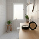 Open tin of Om Naturale Hygge Shower in a Tin showing compressed travel towels.