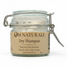Om Naturale Natural Dry Shampoo in a recyclable and/or refillable flip top glass jar.