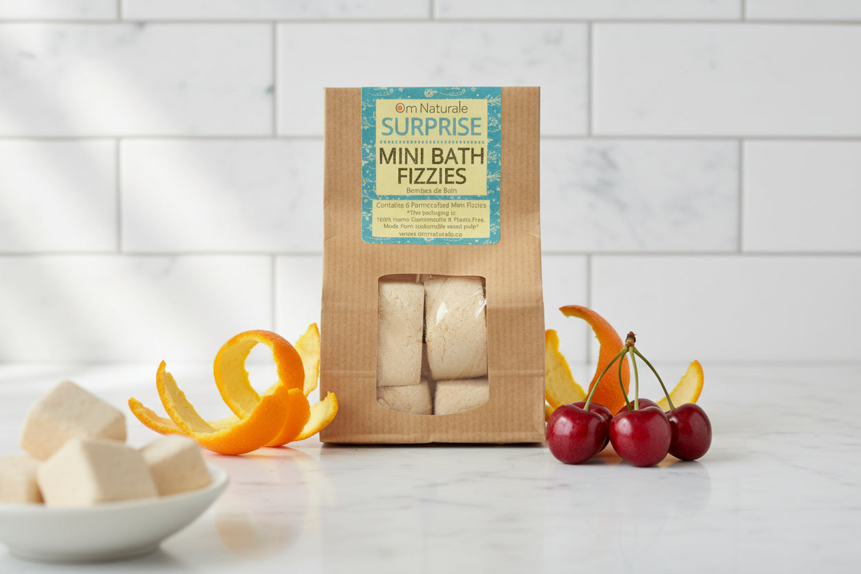Om Naturale Surprise Mini Fizzies in bathtub setting, plant-based bath fizzies with natural botanicals and essential oils for soothing and playful bath experience