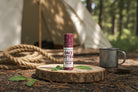 Once Bitten salve in use on the go – portable compostable stick for natural itch relief from bug bites, plantain poplar infusion with lavender tea tree, eco care by Om Naturale Canada.